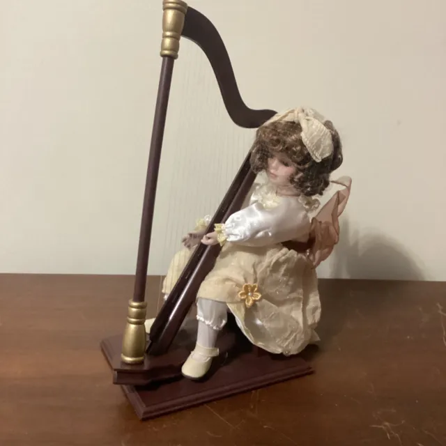 Musical Mallory with Harp Porcelain Doll By Heritage Signature Collection