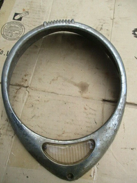 late 1930's Ford tear drop headlamp bezel door with glass park lens P/n 8231-A