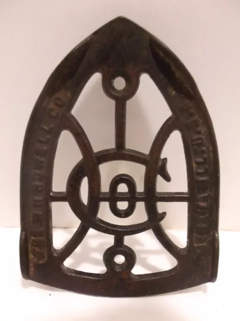 ANTIQUE CAST SAD IRON TRIVET W H Howell Co. Geneva, IL. USA  Black