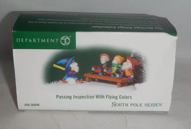 Dept 56 Heritage Village North Pole Series Passing Inspection with Flying Colors