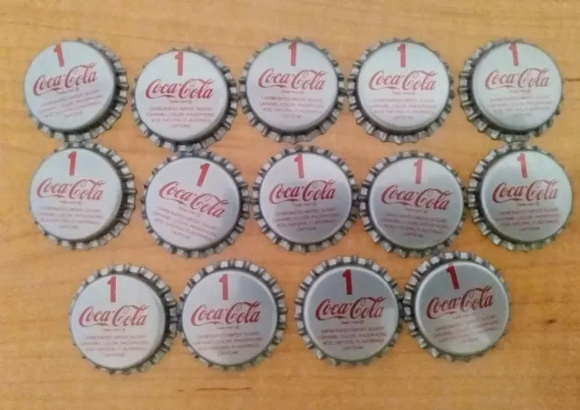Lot of 14 Coca-Cola 1 Silver Coke Bottle Caps Unused