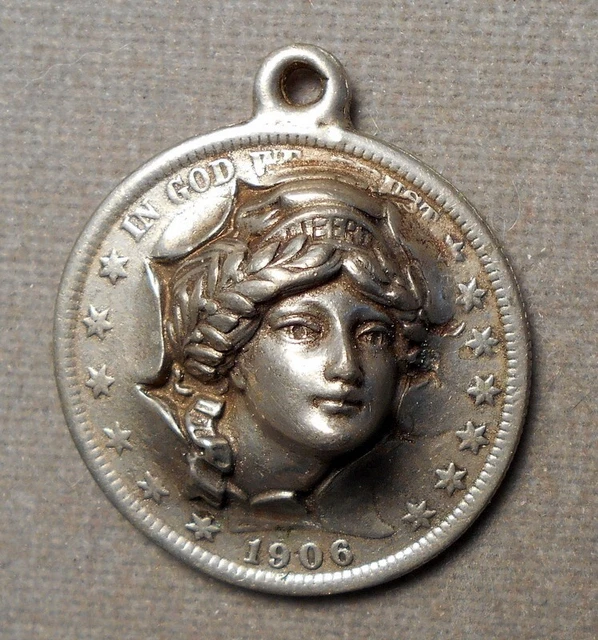 7403 Repousse – Popout: Liberty Head On 1906 Barber 50c. Attached loop, no paten