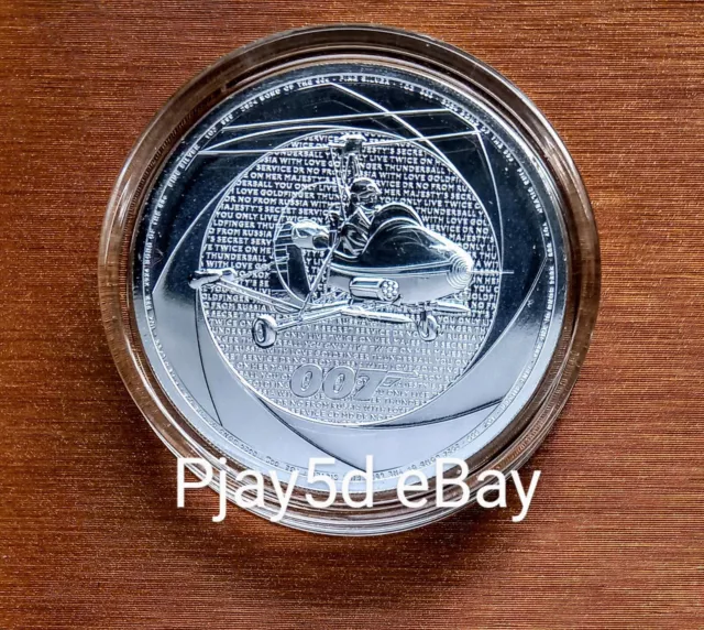 2024 James Bond Six Decades Of 007 1oz Silver Bullion Coin In Capsule In Hand
