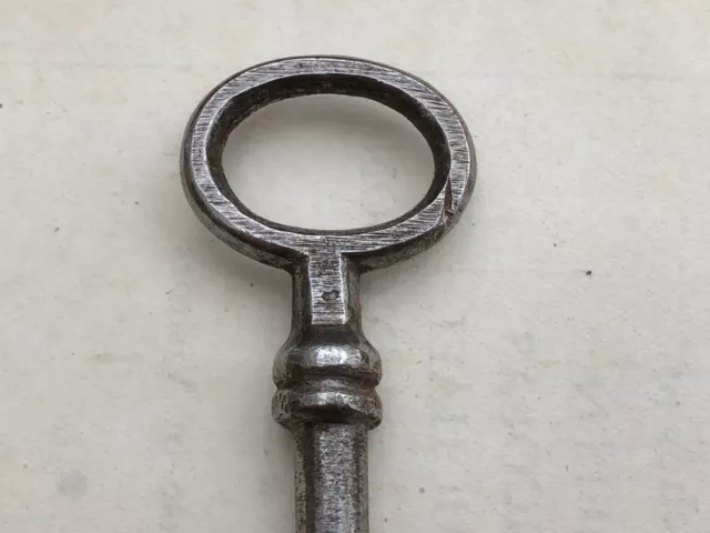 fairly large victorian or edwardian shiny steel key with a hollowed out end 3