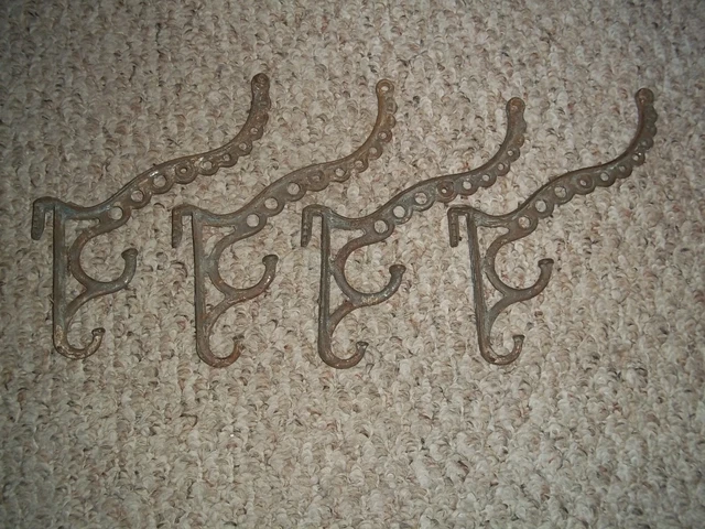 4 Antique Coat Hooks Circa 1880`s Cast Iron