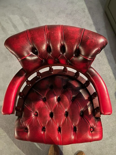 A beautiful vintage red leather Chesterfield Captains Chair