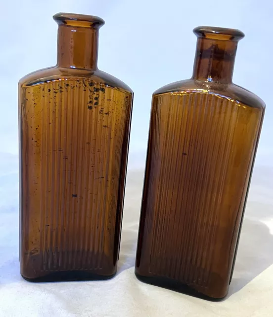 VINTAGE BROWN RIBBED POISON / LOTION BOTTLES x 2  6" TALL