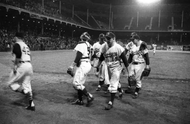 Brooklyn Dodgers Gil Hodges walking off and players shaking hands - Old Photo