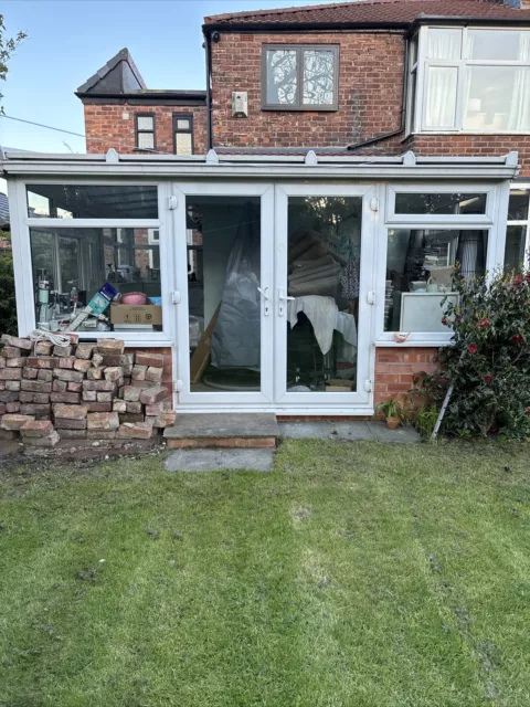 used white upvc conservatory. 18 windows, double French doors And Single Door.