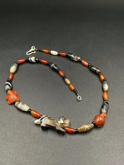 Old Banded Agate beads with tiger figure carved bead from Pyu south east Asia