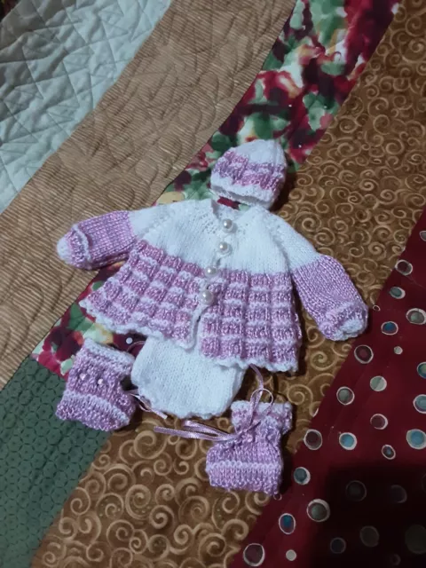 Small hand knitted dolls clothes