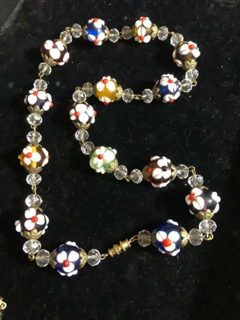 VINTAGE MIXED COLORED GLASS BEADED NECKLACE with RAISED WHITE & RED FLOWERS BEAD