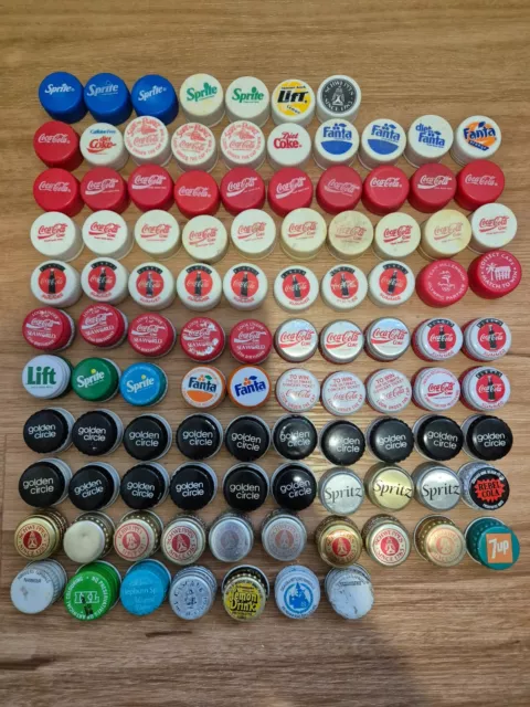 104 bottle caps, Coca cola , Fanta , Sprite , Golden Circle , Schweppes , etc