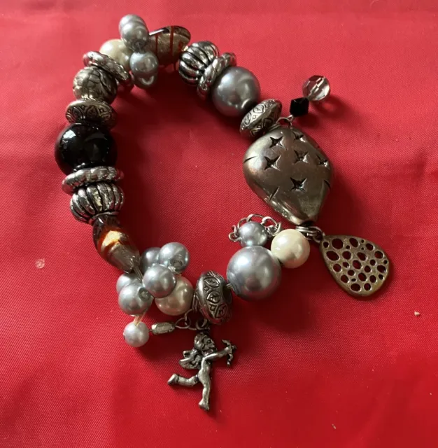 Metal and Glass Bead Bracelet Featuring Two Hearts Shaped bead and Cherub Charm