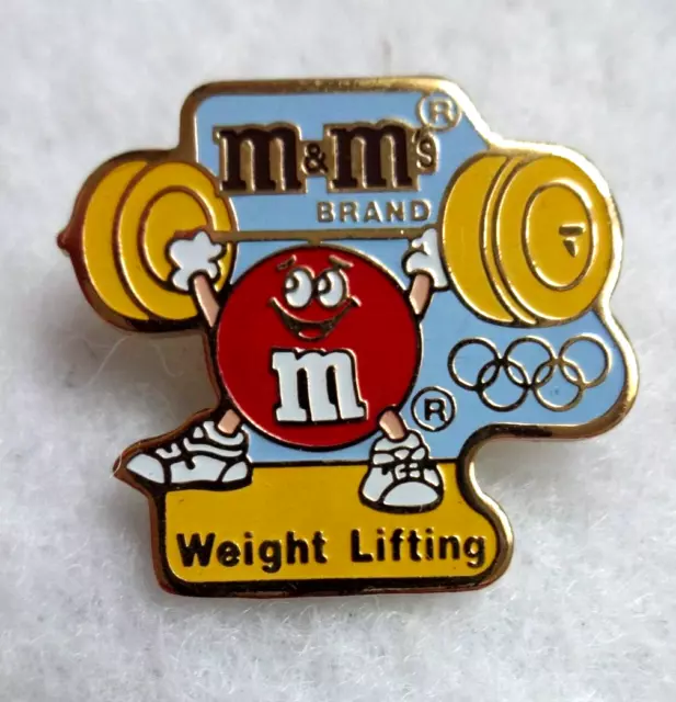 M&M's - 1992 OLYMPIC GAMES - WEIGHT LIFTING - PIN BADGE