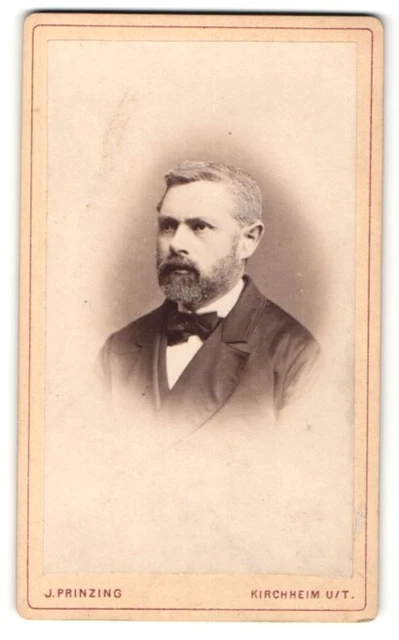 Fotografie J. Prinzing, Kirchheim / Hessen, Portrait charmanter Herr mit Vollba
