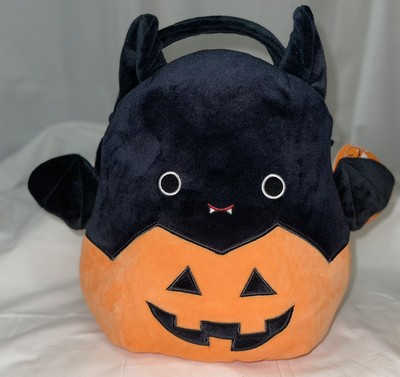emily in a pumpkin squishmallow