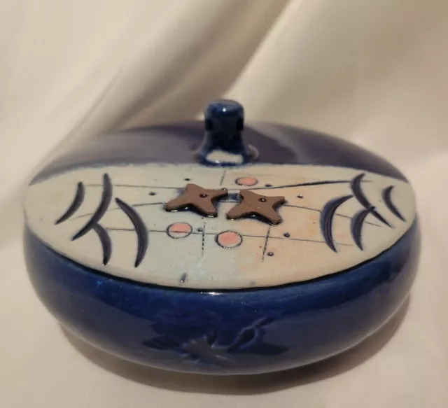 Colbalt blue ceramic trinket dish with artistic modern design on lid and birds 
