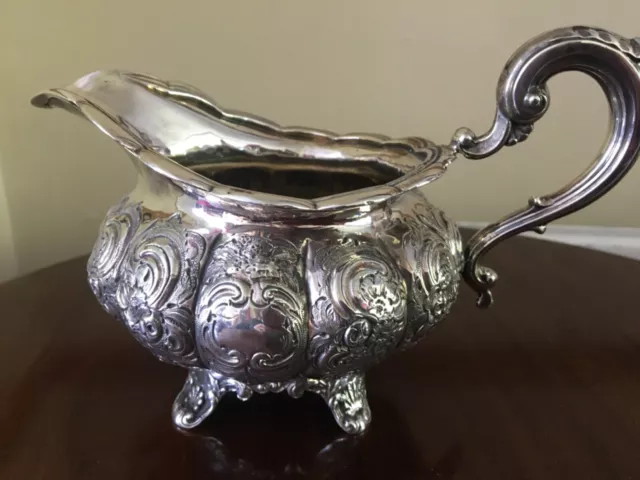 Antique ornate solid silver milk jug London 1829, 260 grams . marks slightly wor