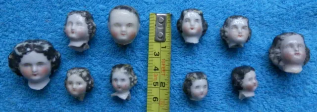 10 old painted Frozen Charlotte doll heads , damage , Limbach