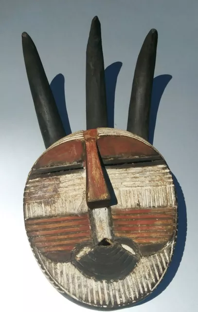 African art carving wood horned mask sculpture statue red and white from Congo.