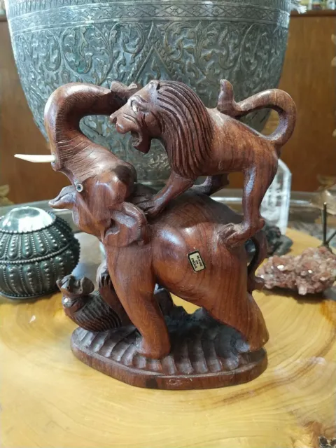 Vintage hand carved wood sculpture figurine. lions attacking an elephant. India