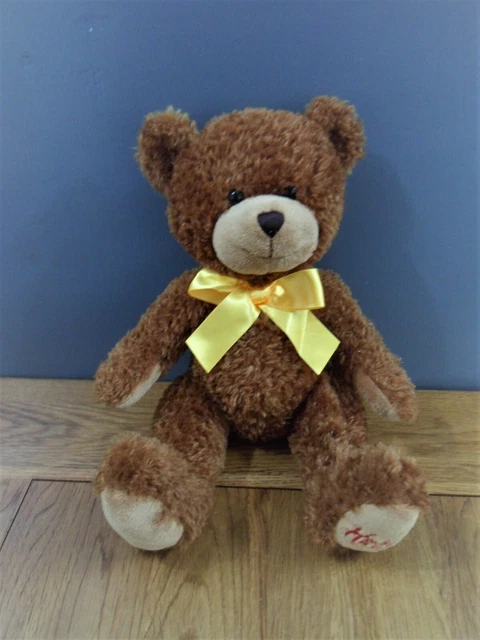 hamleys-dark-brown-teddy-bear-with-yellow-bow-9-seated-soft-toy-4-00