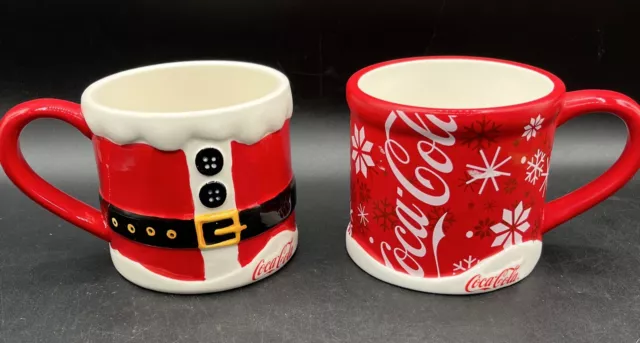 Coca Cola Christmas Holiday Red and White Snowflake/Santa Mugs 5.5"* 4" Lot Of 2