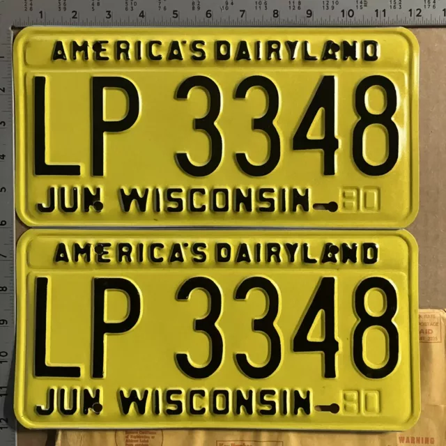 1980 Wisconsin license plate pair LP 3348 YOM DMV mint with envelope 15553