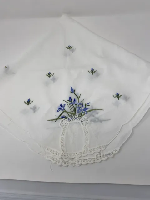 Handmade table topper. 32” Square. Embroidered Blue Flowers In A Vase On Corners