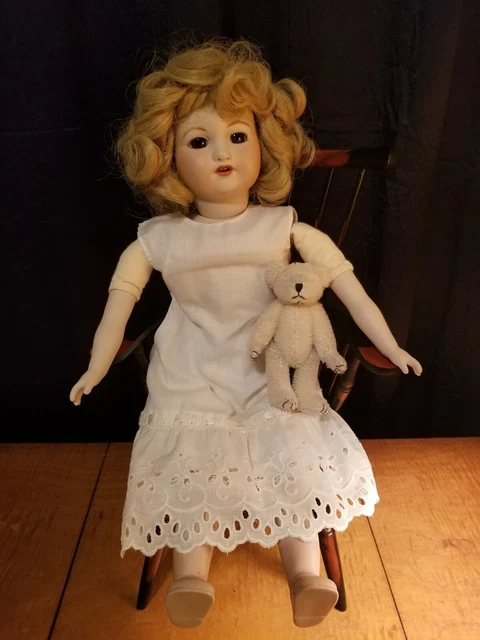 Antique reproduction bisque porcelain turn-head doll blonde pin curls brown eyes