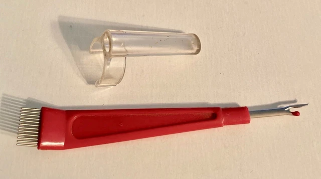 Destripador de costura con soporte para clip para dedos