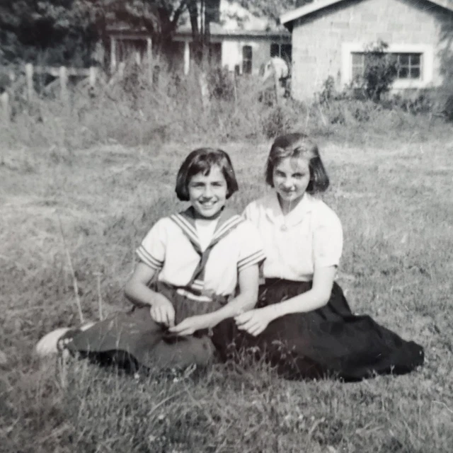 Vintage Two Girls in Skirts Sailor Top Sitting Field 1956 Saddle Shoes Peeking