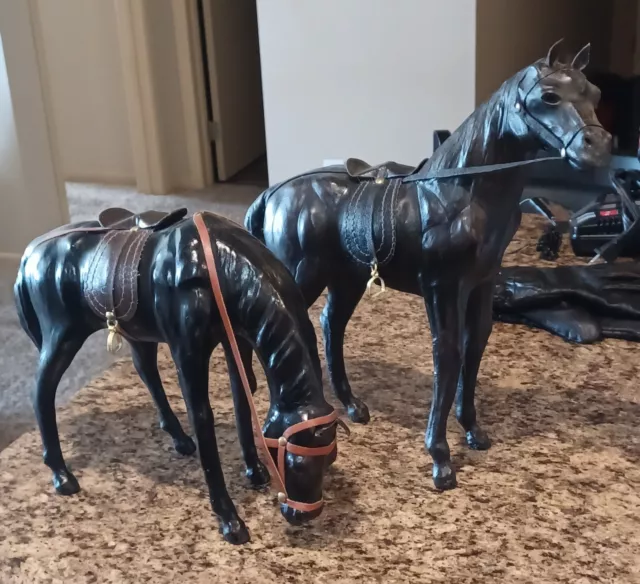 A pair of Equestrian Leather Wrapped Horse Statue Figures With Saddles 13”