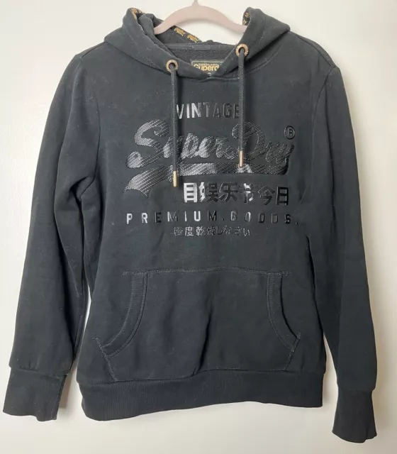 SUPERDRY schwarz auf schwarz Logo Kapuzensweatshirt Oberteil Größe UK 16 goldene Borte