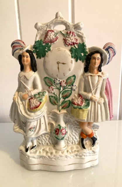 Antique Staffordshire Flatback, mid 19th century, couple with grapes in baskets