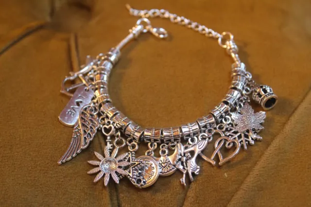 Silver Tone Charm Bracelet with Various Charms Crown Compass Angel Wings