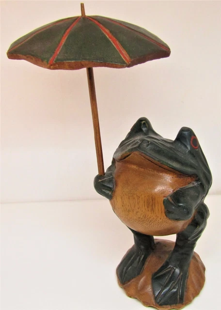 Hand Carved Wooden Frog Holding A Striped Wooden Umbrella.