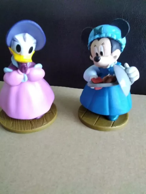 Two Disney characters Minnie mouse and Mrs Donald duck