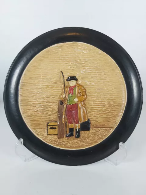 A Bretby Art Pottery Dickensian Ware Wall Plaque No.3012D, Appr. 21cm Wide