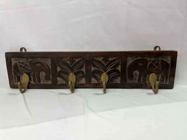 Wooden Cloth or key hanger. Hand Carved with 4 Stylish metal hooks.