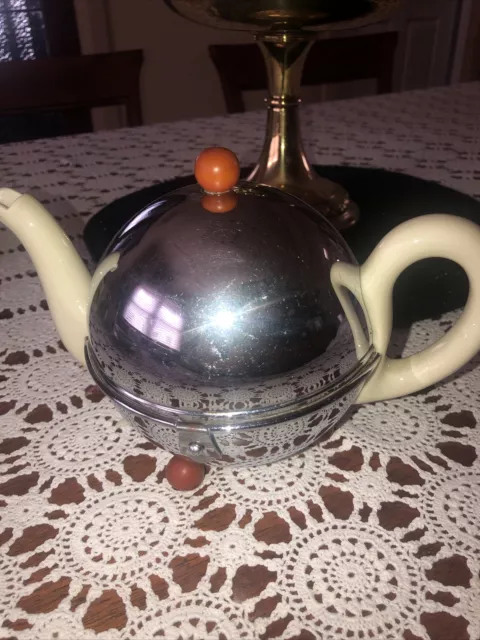 Art Deco BAUSCHER WEIDEN DRP Porcelain Teapot with silver shell. Bakelite Feet.