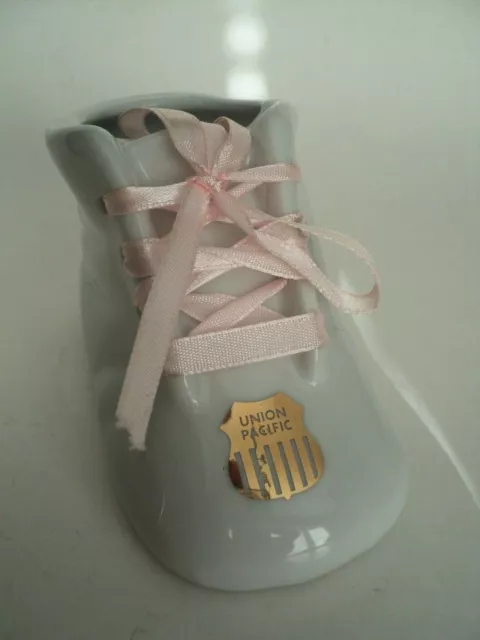Union Pacific RR Gold Logo on porcelain baby shoe souvenir?