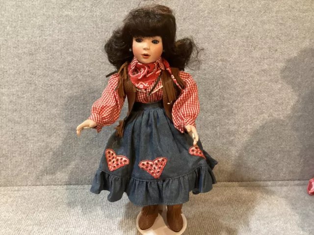 *Paradise Galleries Treasury Collection Finest Porcelain Cowgirl doll on Stand