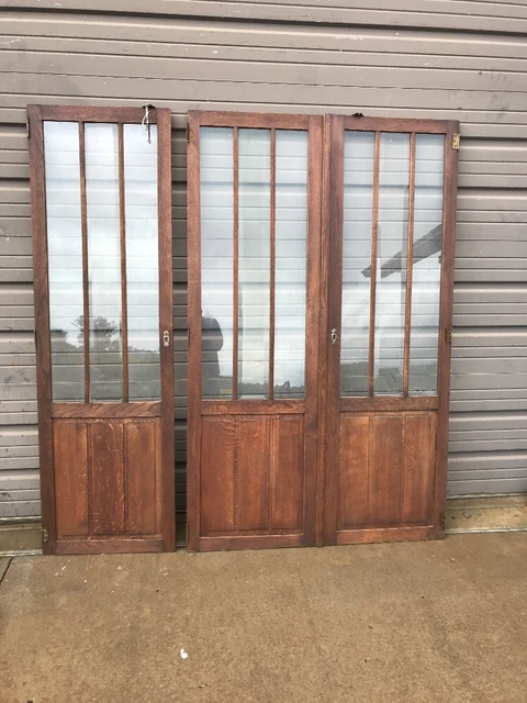 AN three-piece antique oak beveled glass center cabinet doors