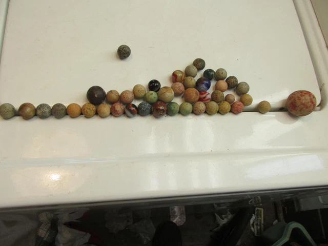 45 Marbles Most Are Clay 1 Shooter Most Have Colors In Them Very Wild Looking