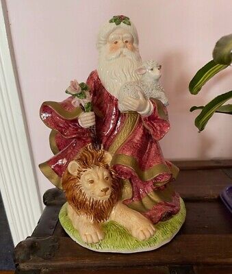 Ceramic Santa holding lamb & rose with lion at his feet, music box, gently used