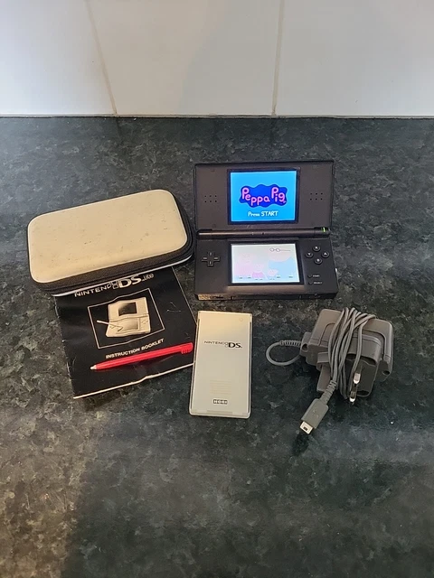 Nintendo DS Lite Handheld Console Black with Peppa Pig game and genuine charger.