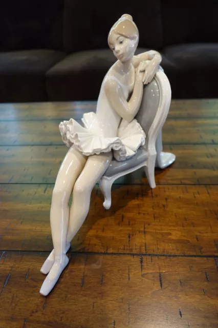 Lladro #4847 "Classic Dance" ballerina sitting in a chair. Mint condition