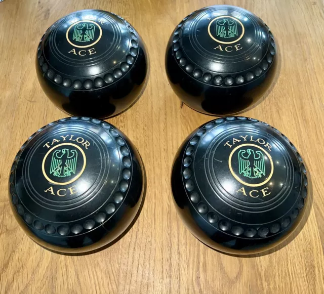A Stunning Set of 4 Thomas Taylor Ace Professional Lawn Bowls - Black Size 4